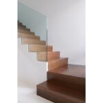 Glass-balustrade-wooden-stairs-cairns